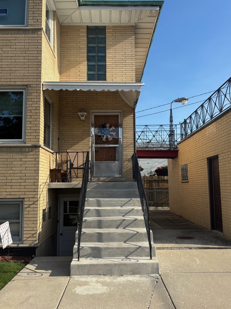 6401 West 52nd Street, Unit 2 Chicago, IL 60638 - Photo 2 of 16 a front view of a house with entryway
