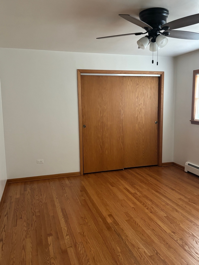 6401 West 52nd Street, Unit 2 Chicago, IL 60638 - Photo 11 of 16 a view of an empty room with a ceiling fan