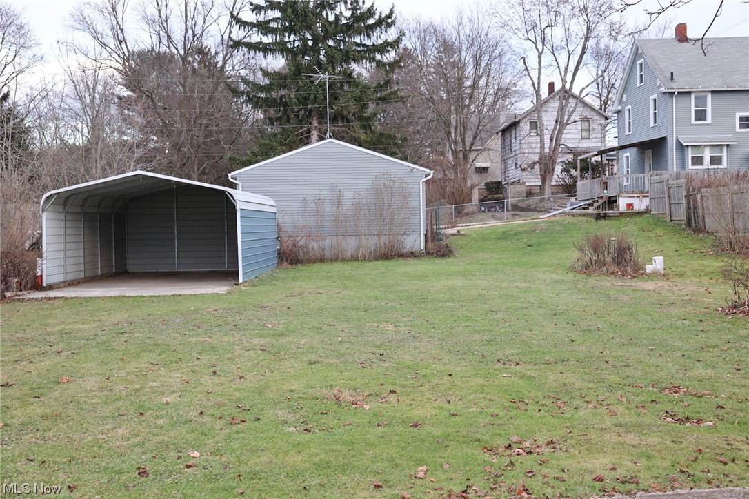 1309 Krumroy Road Akron, OH 44306 - Photo 22 of 30 View of yard featuring a carport