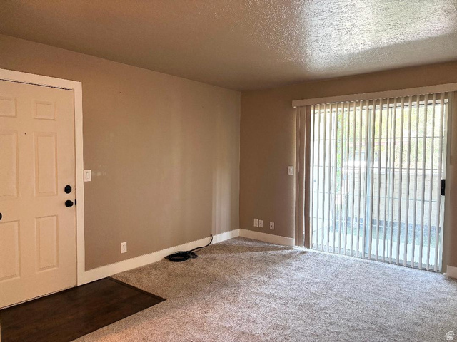 1212 East Waterside Cove, Unit 10 Midvale, UT 84047 - Photo 4 of 31 NICE FAMILY ROOM WITH SLIDING DOORS!