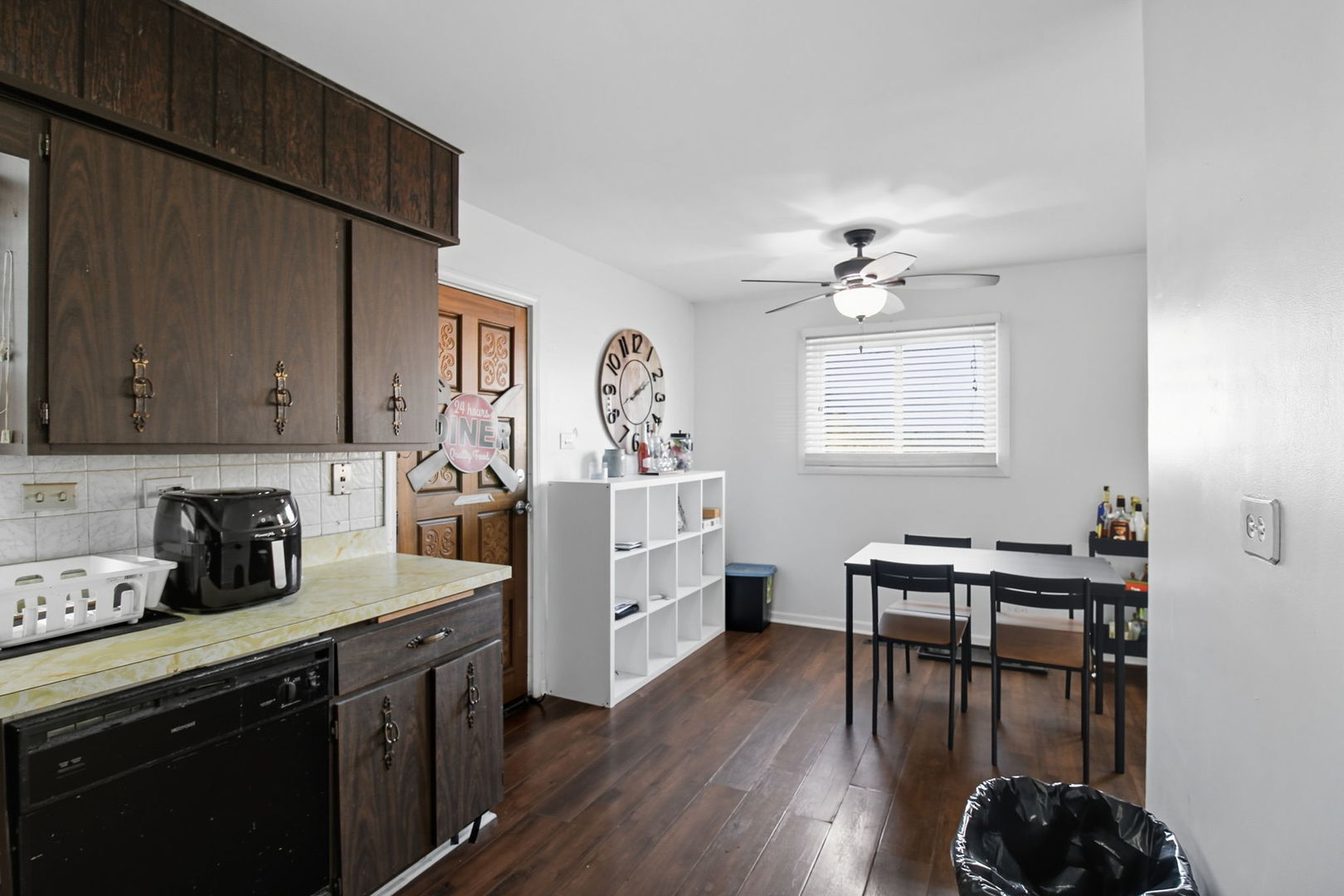 6611 West 83rd Street Burbank, IL 60459 - Photo 12 of 29 a kitchen with sink cabinets and wooden floor