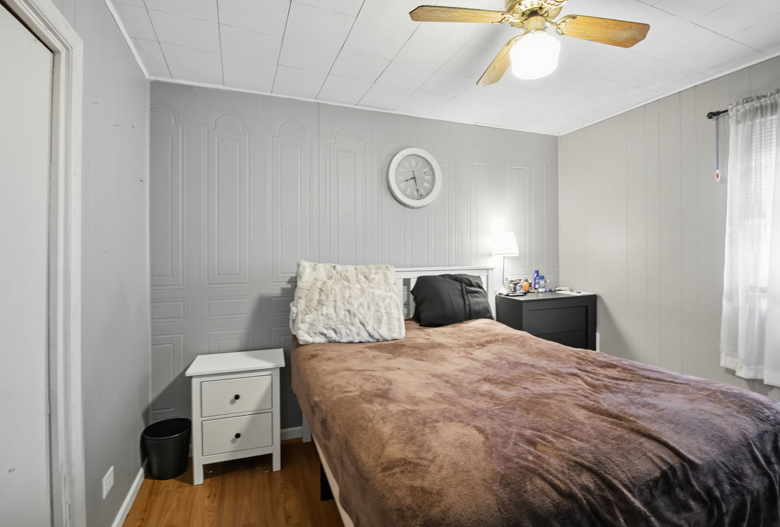 6611 West 83rd Street Burbank, IL 60459 - Photo 17 of 29 a bedroom with a bed and a chandelier