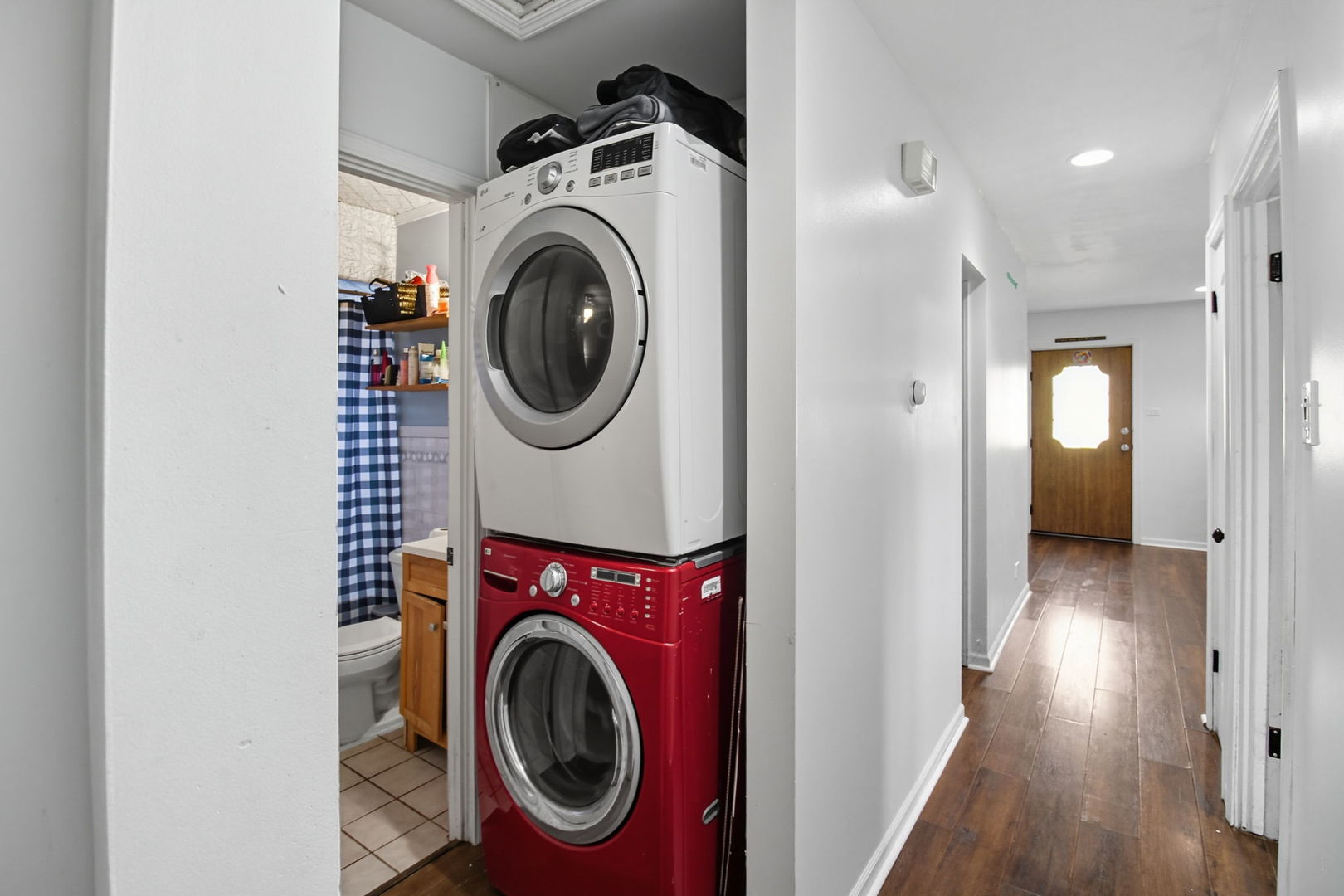6611 West 83rd Street Burbank, IL 60459 - Photo 18 of 29 a view of a hallway with washer and dryer
