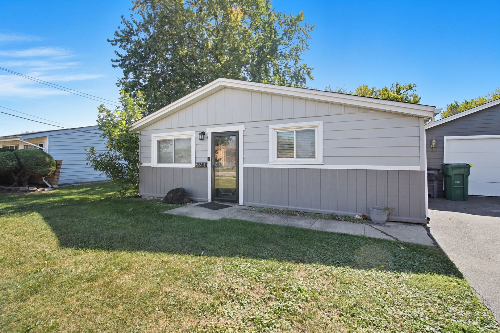 6611 West 83rd Street Burbank, IL 60459 - Photo 2 of 29 a view of a backyard with a garden and plants