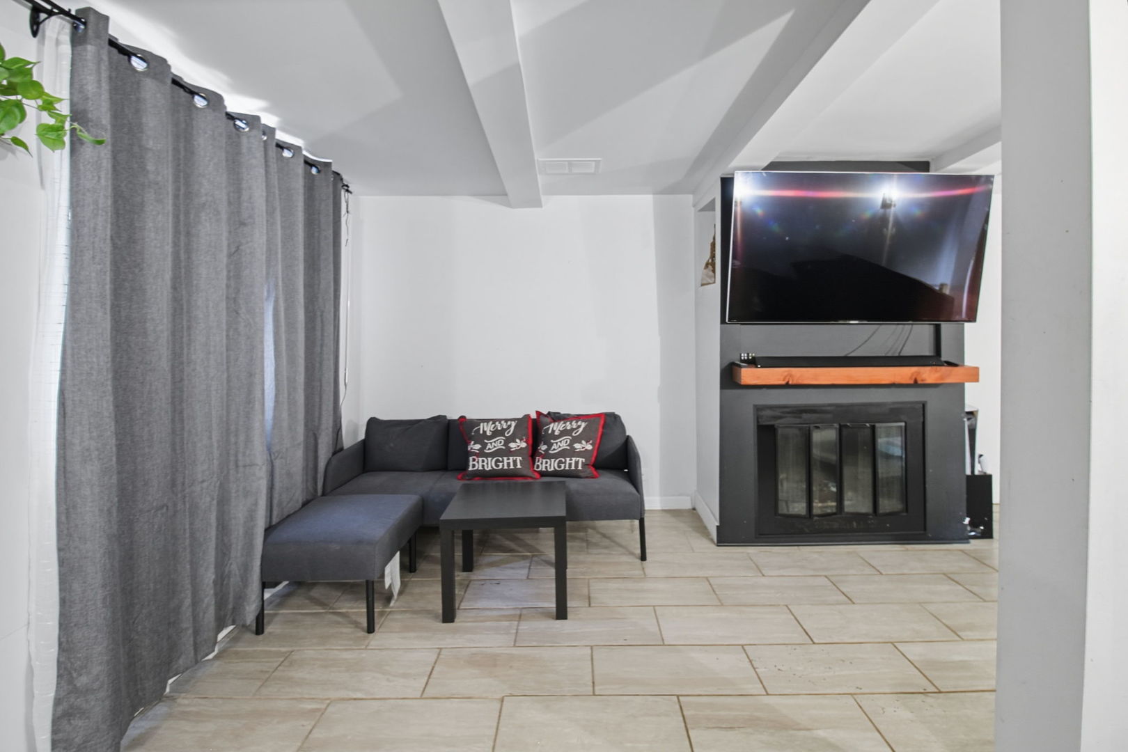 6611 West 83rd Street Burbank, IL 60459 - Photo 22 of 29 a living room with furniture and a flat screen tv