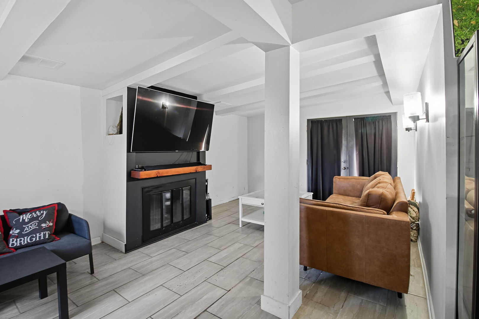 6611 West 83rd Street Burbank, IL 60459 - Photo 24 of 29 a living room with furniture and a flat screen tv