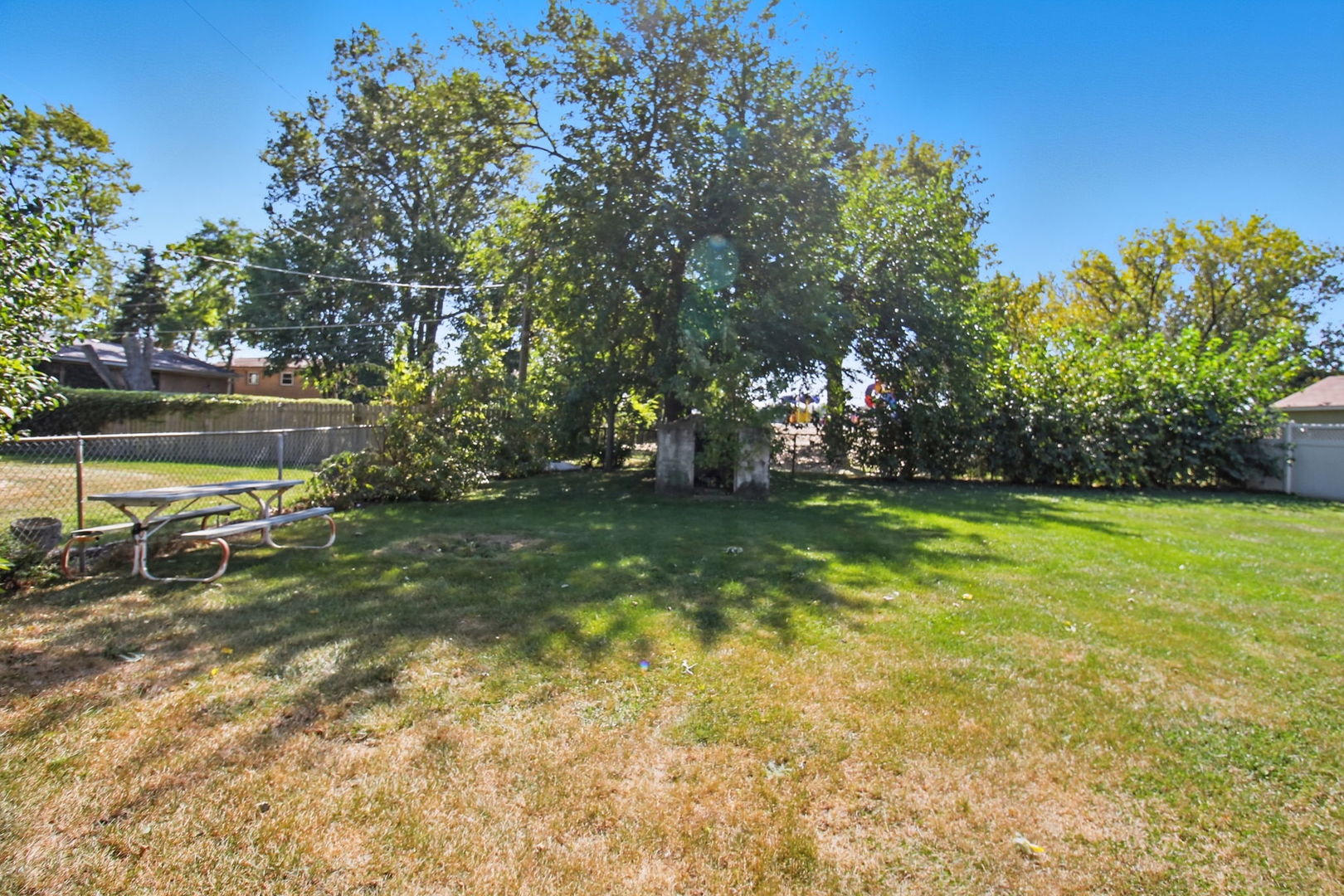 6611 West 83rd Street Burbank, IL 60459 - Photo 27 of 29 a view of yard with swimming pool and green space