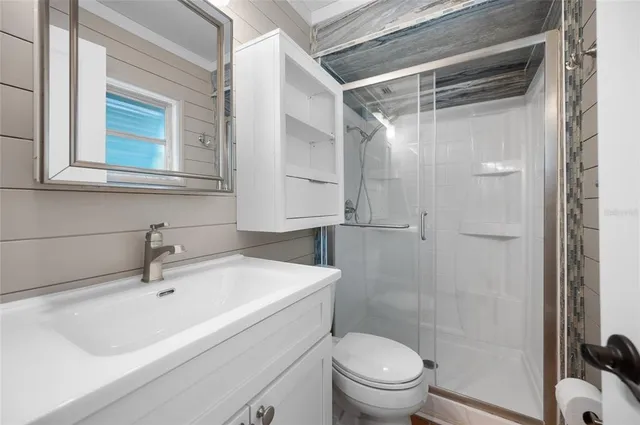 a view of empty room with large windows