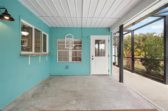 a view of a backyard with plants and a garden