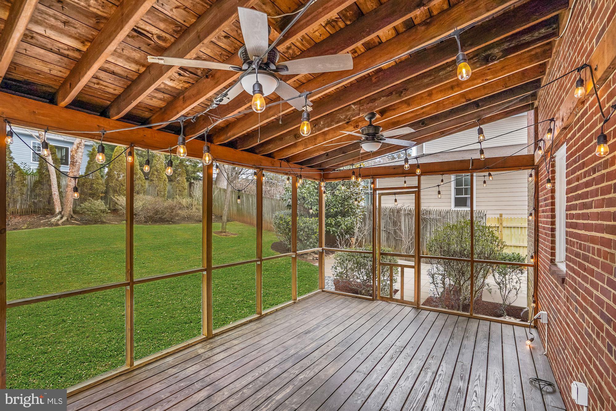 5919 Wilmett Road Bethesda, MD 20817 - Photo 22 of 27 Screened-In Porch with String Lights