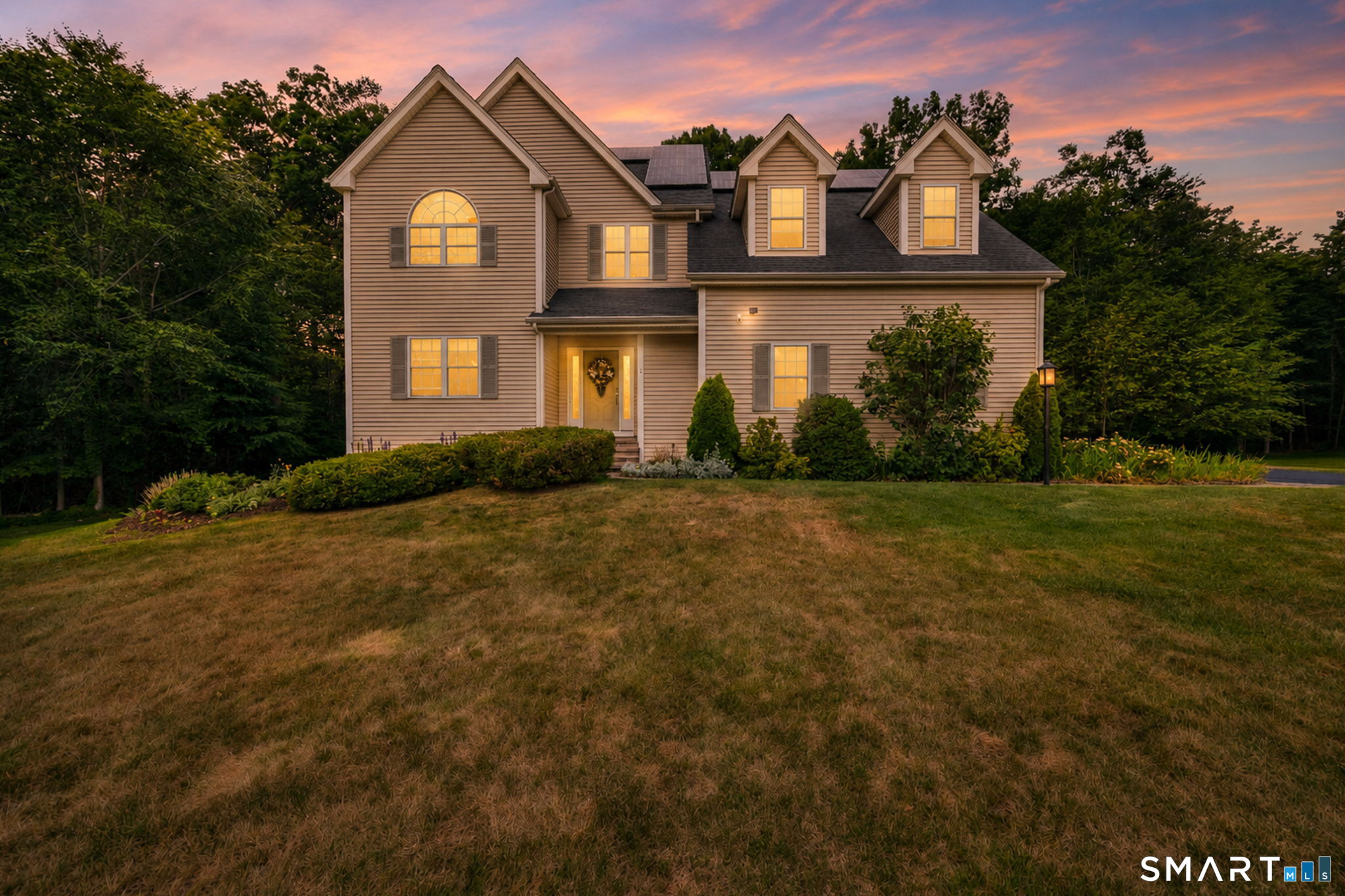 5 Edwards Way Bloomfield, CT 06002 - Photo 2 of 40 5 Edwards Way is a custom-built home with luxury finishes on a 10-property cul-de-sac bordered by wooded landscape.