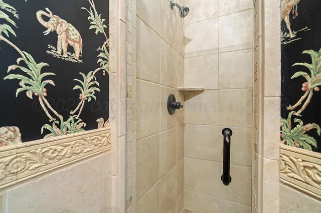 a bathroom with a bathtub and shower