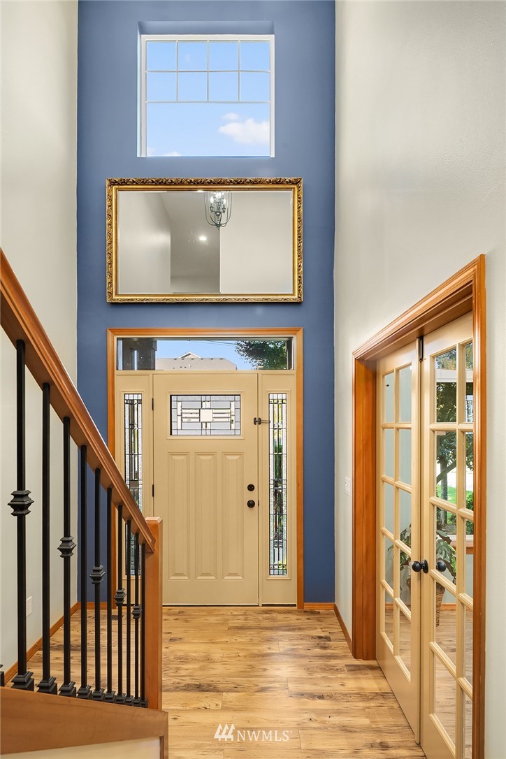 210 Hubbard Road, Unit 2 Lynnwood, WA 98036 - Photo 3 of 25 a view of a hallway with wooden floor and windows