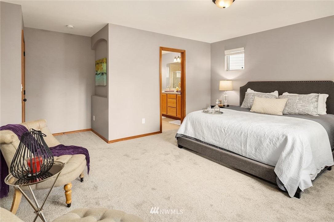 210 Hubbard Road, Unit 2 Lynnwood, WA 98036 - Photo 22 of 25 a spacious bedroom with a bed a couch and a dresser