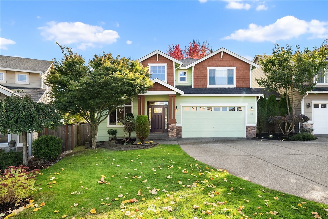210 Hubbard Road, Unit 2 Lynnwood, WA 98036 - Photo 25 of 25 a front view of a house with a yard and garage