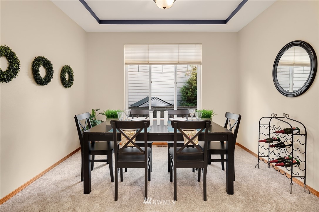 210 Hubbard Road, Unit 2 Lynnwood, WA 98036 - Photo 4 of 25 a view of a dining room with furniture and chandelier
