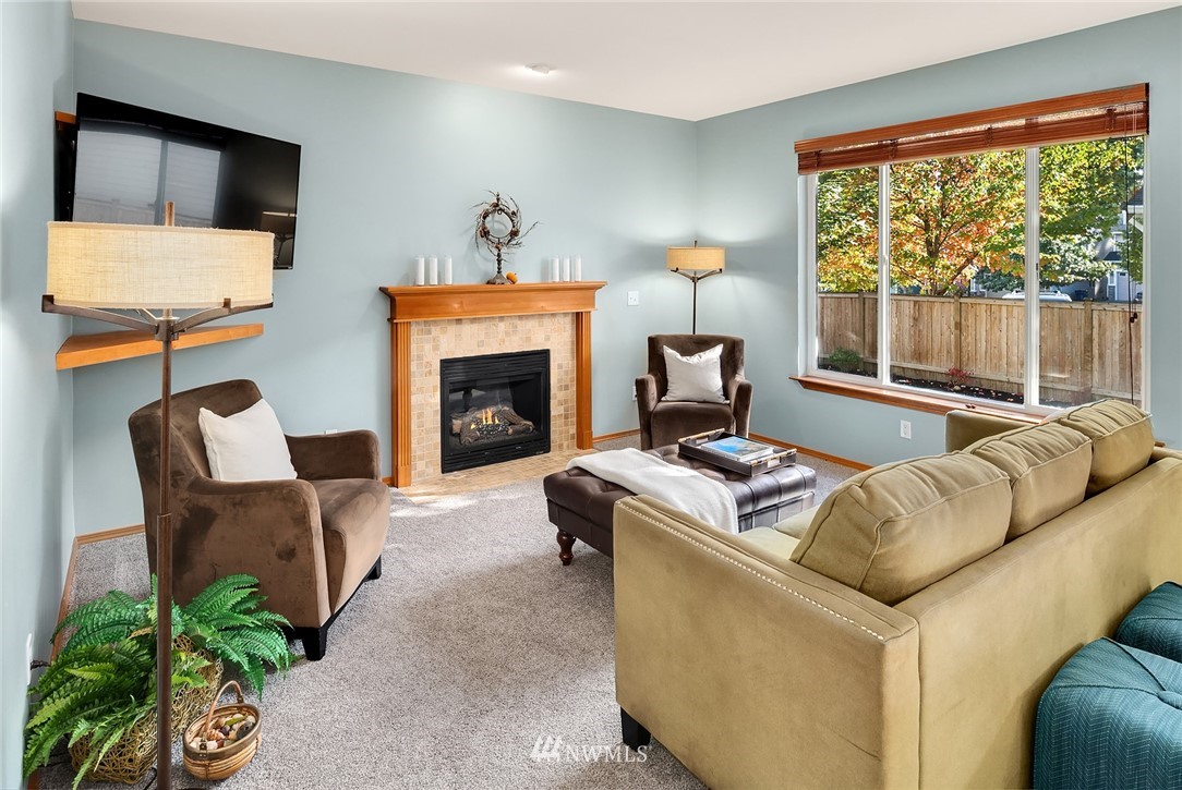 210 Hubbard Road, Unit 2 Lynnwood, WA 98036 - Photo 5 of 25 a living room with furniture and a fireplace
