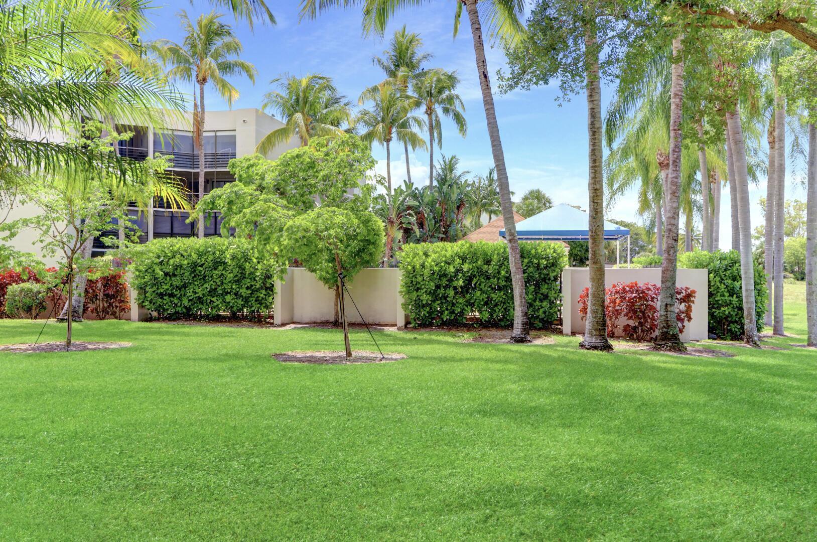 5800 Camino Del Sol, Unit 103 Boca Raton, FL 33433 - Photo 3 of 28 PATIO VIEW OF COMM. POOL