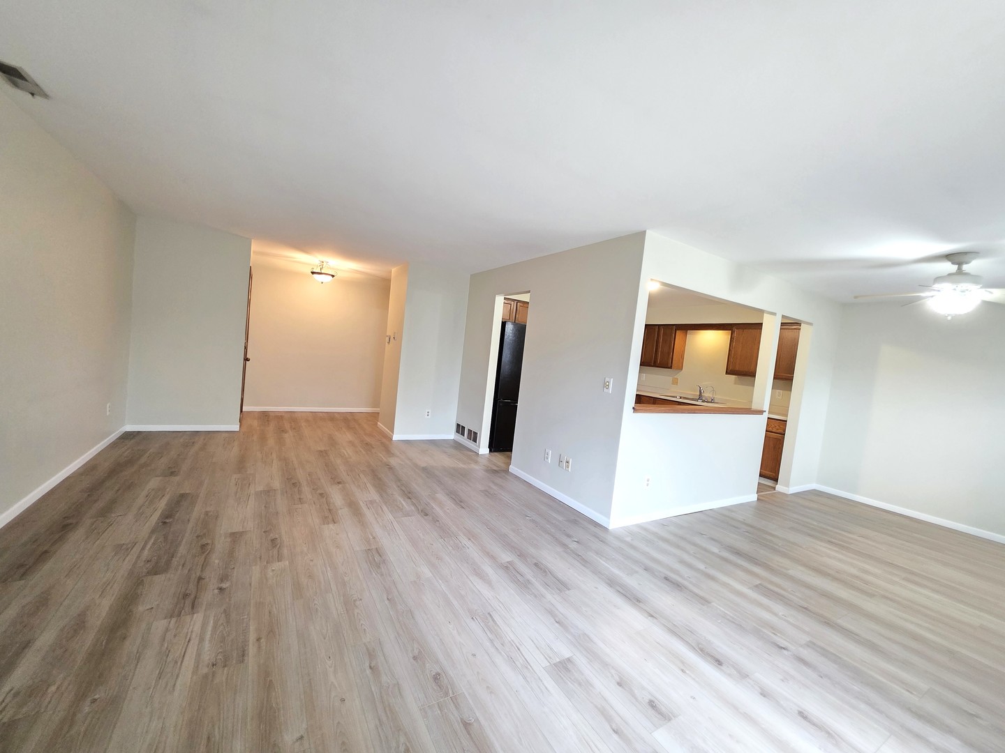 205 Auburn Court, Unit 205 St. Charles, IL 60174 - Photo 3 of 16 a view of empty room with wooden floor