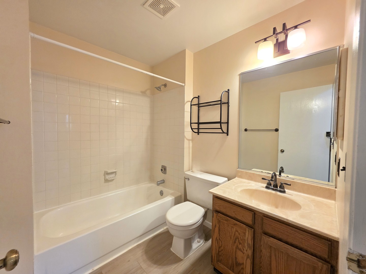 205 Auburn Court, Unit 205 St. Charles, IL 60174 - Photo 7 of 16 a bathroom with a granite countertop sink toilet a mirror and shower