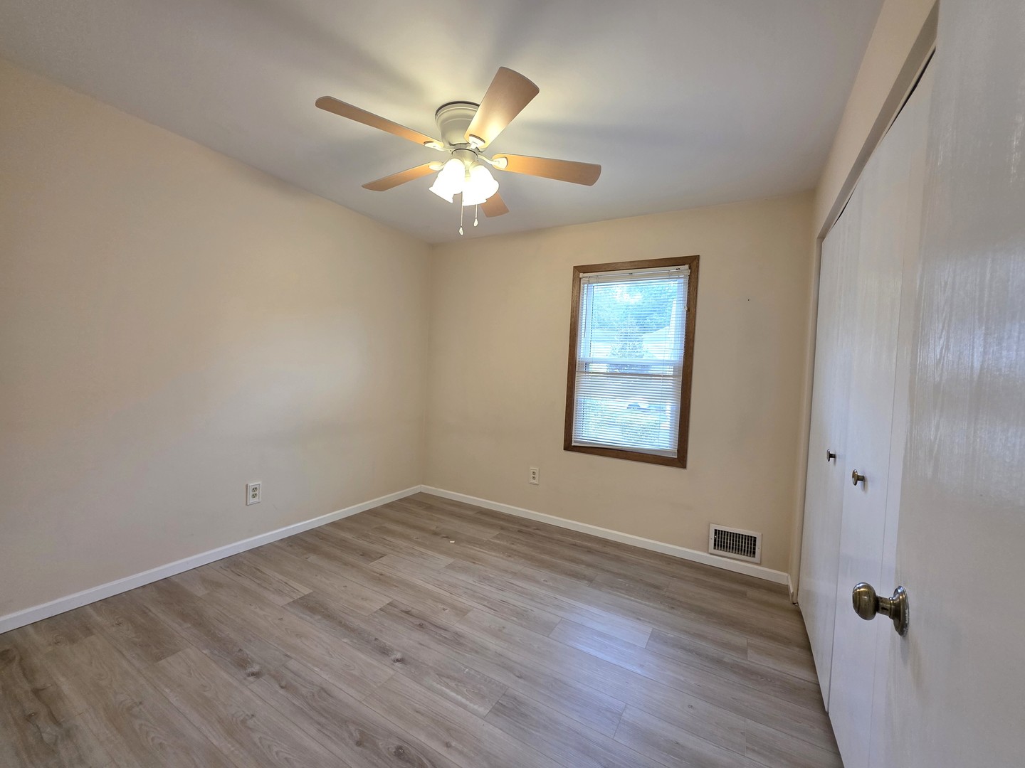 205 Auburn Court, Unit 205 St. Charles, IL 60174 - Photo 9 of 16 wooden floor in an empty room with a window