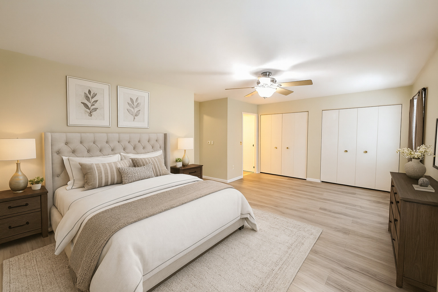 205 Auburn Court, Unit 205 St. Charles, IL 60174 - Photo 10 of 16 a spacious bedroom with a bed and a chandelier