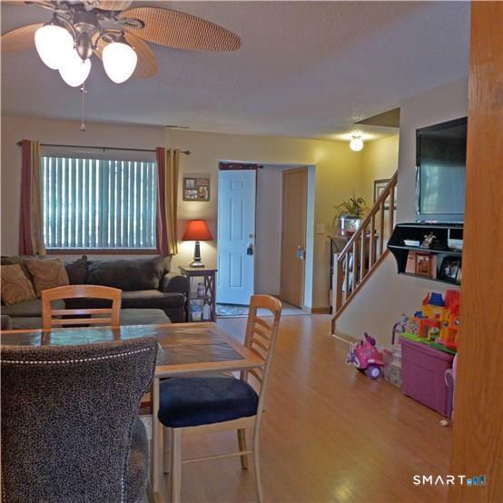 11 MacIntosh Lane, Unit 11 Ansonia, CT 06401 - Photo 6 of 13 a living room with furniture and a window