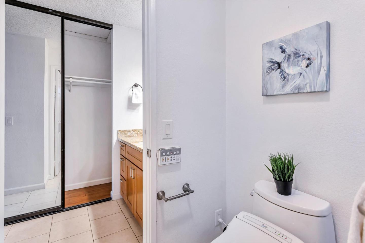 499 Bayview Park Drive Milpitas, CA 95035 - Photo 29 of 41 a bathroom with a toilet a sink and a mirror