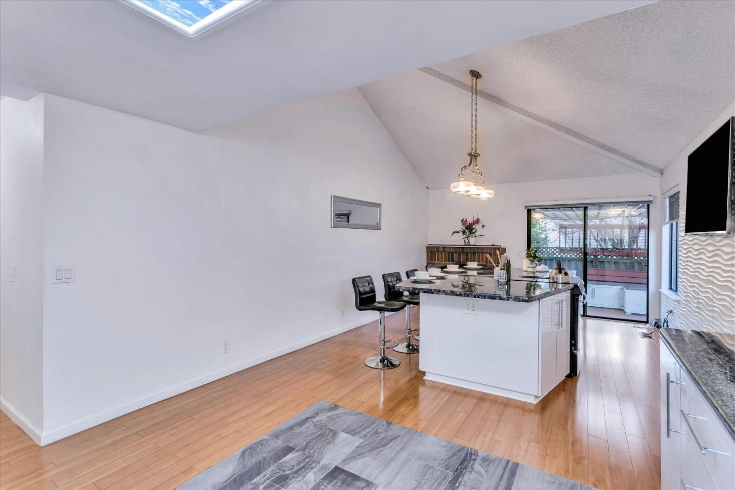499 Bayview Park Drive Milpitas, CA 95035 - Photo 10 of 41 a living room with furniture and a wooden floor