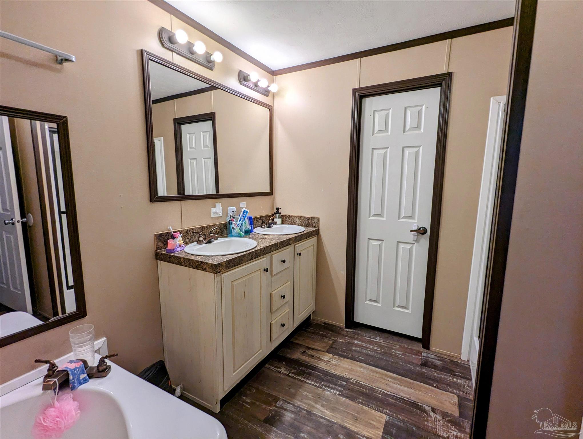 6261 Morgan Road Milton, FL 32570 - Photo 12 of 19 a bathroom with a sink vanity and a mirror