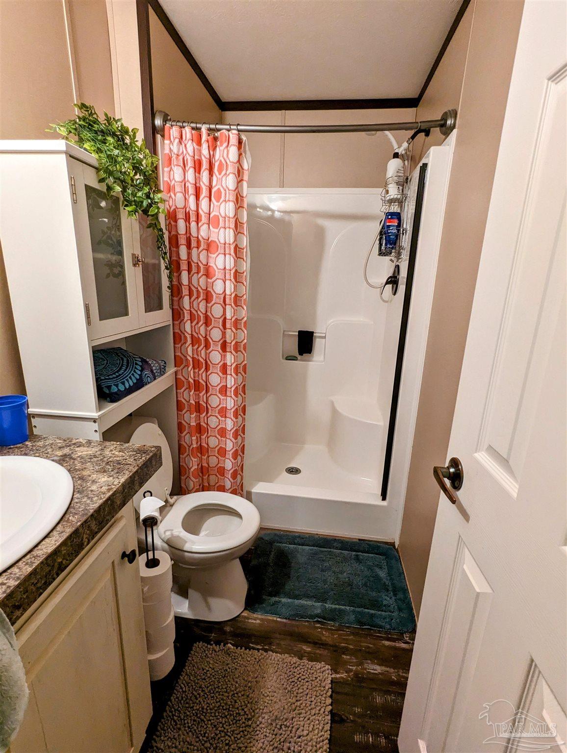 6261 Morgan Road Milton, FL 32570 - Photo 17 of 19 a bathroom with a sink toilet and shower