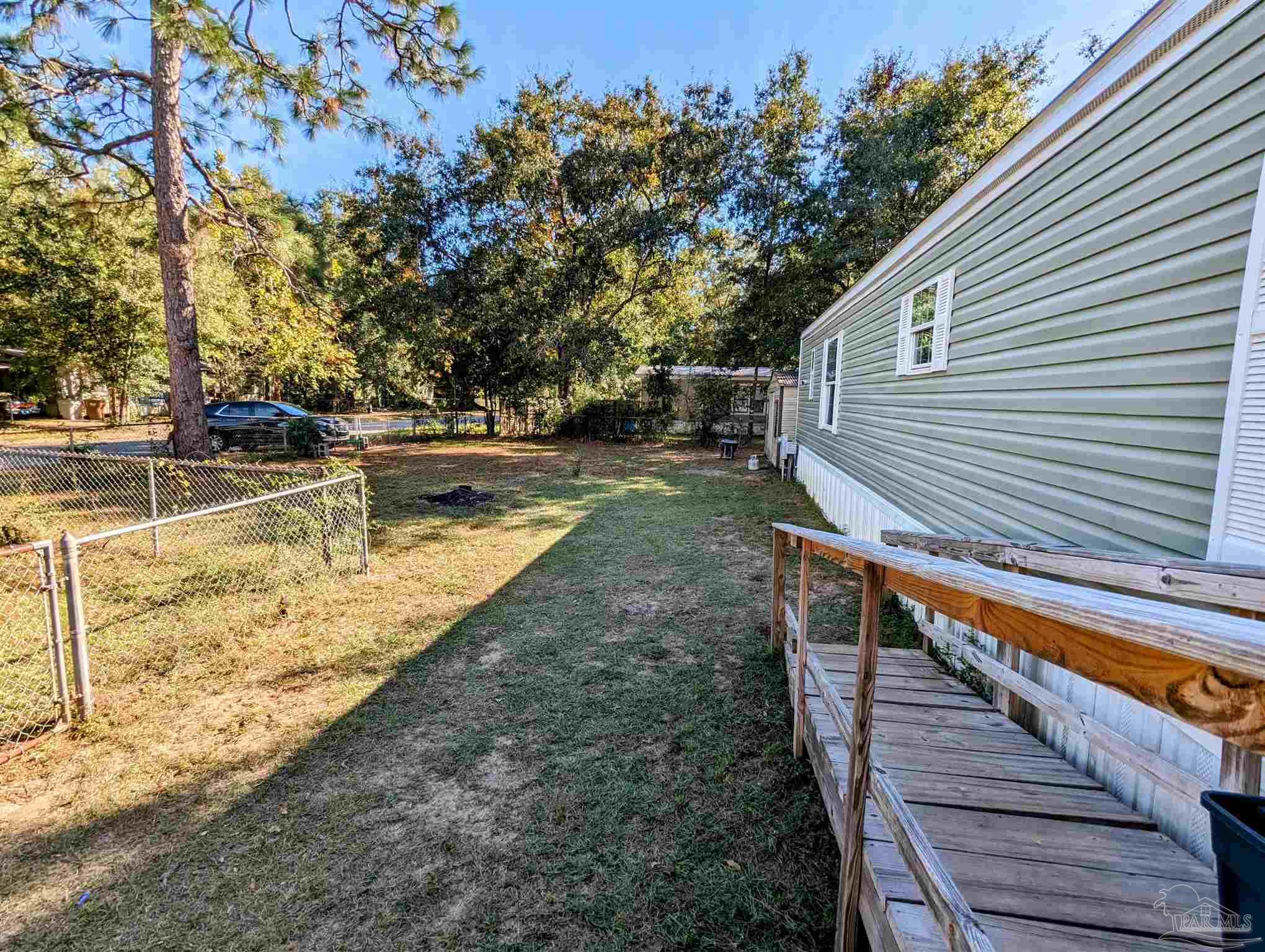 6261 Morgan Road Milton, FL 32570 - Photo 2 of 19 a view of a house with backyard and trees