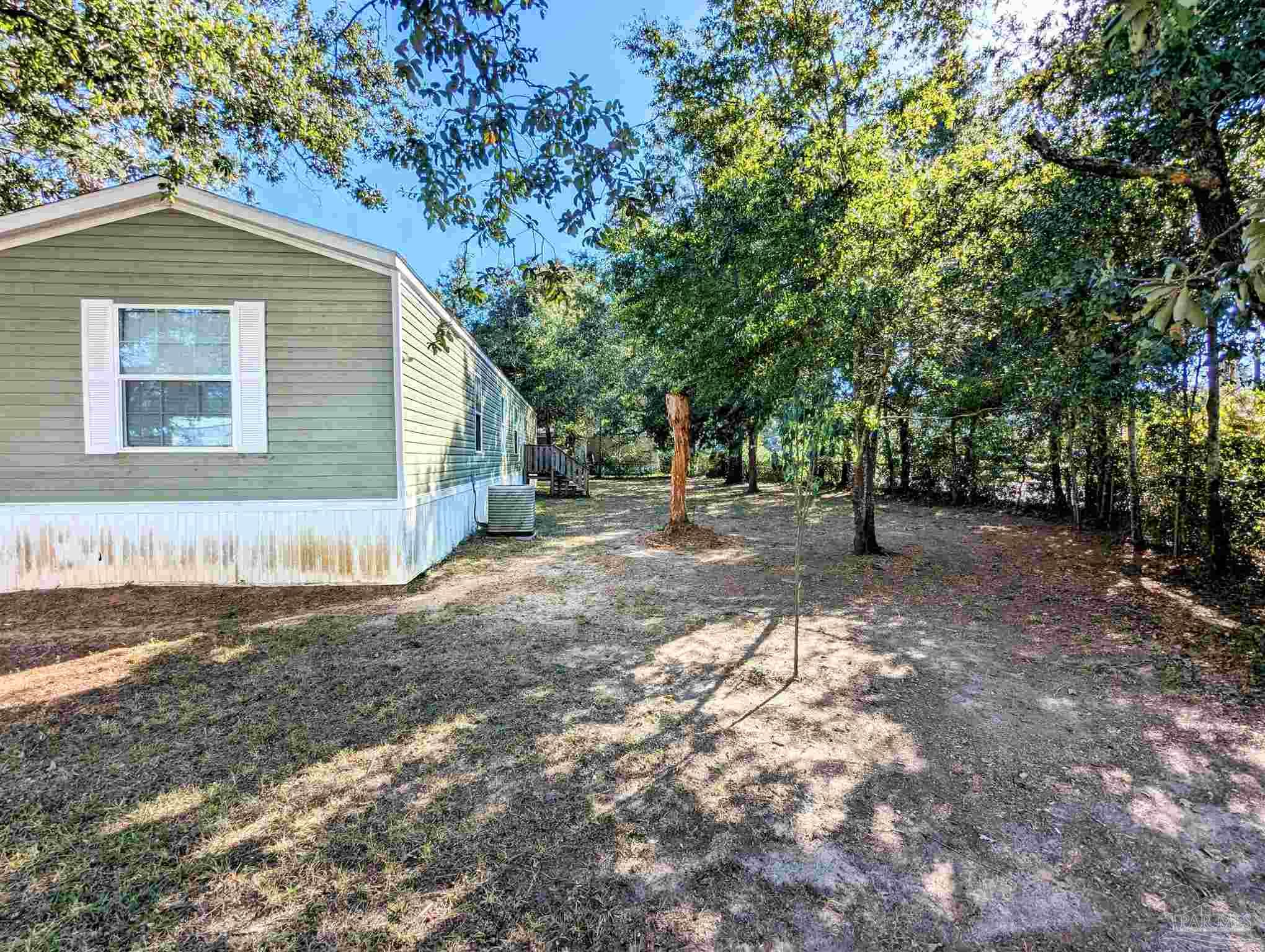 6261 Morgan Road Milton, FL 32570 - Photo 4 of 19 a view of backyard of house with green space