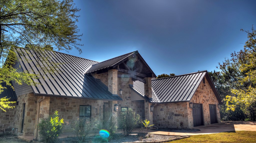 6454 Highway 83 Leakey, TX 78873 - Photo 2 of 74 a front view of a house with a garden