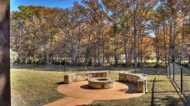 a view of a lake with couches and wooden floor
