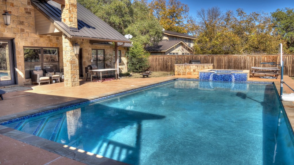 6454 Highway 83 Leakey, TX 78873 - Photo 4 of 74 a view of a house with swimming pool and sitting area