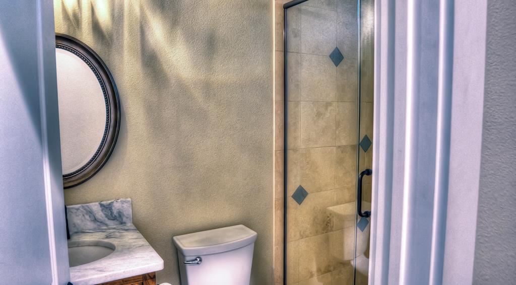 6454 Highway 83 Leakey, TX 78873 - Photo 43 of 74 a bathroom with a toilet and a shower