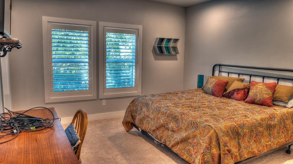 6454 Highway 83 Leakey, TX 78873 - Photo 46 of 74 a bed sitting in a bedroom next to a window