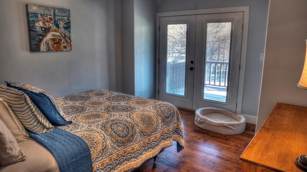 6454 Highway 83 Leakey, TX 78873 - Photo 62 of 74 a bedroom with a bed and wooden floor