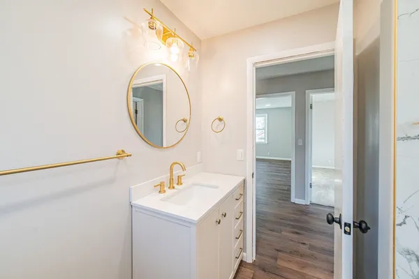 a bathroom with a sink and a mirror
