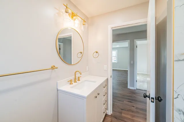 a bathroom with a sink and a mirror