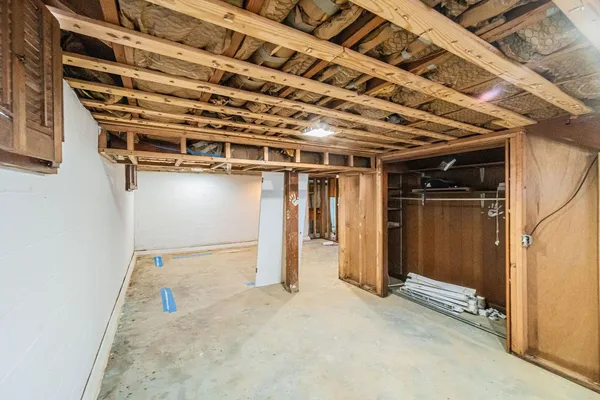 a view of a room with wooden walls