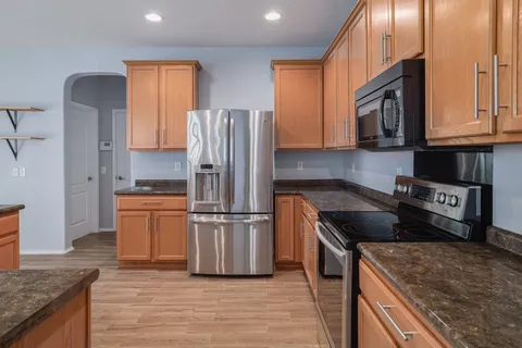 a kitchen with a sink and cabinets