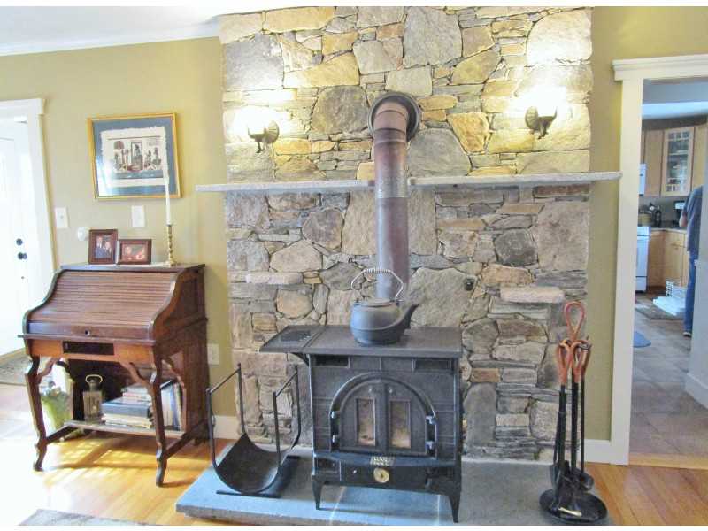 1460 Chopmist Hill Road Scituate, RI 02857 - Photo 11 of 25 Living Room. Wood Stove Remaining With Sale - Granite Accent