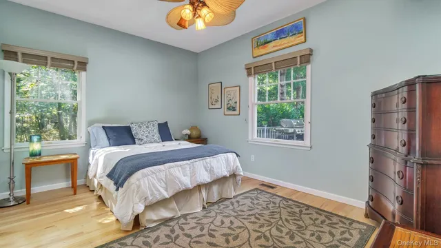 a bedroom with a bed and a table in it