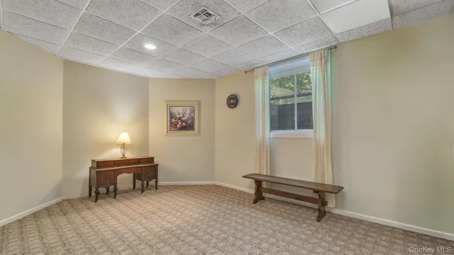 a bedroom with furniture and a window