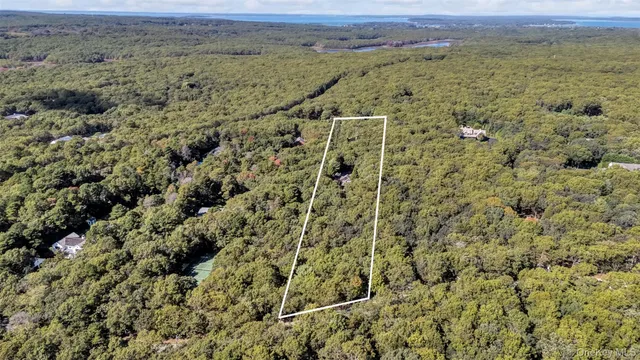 a view of a big house with a big yard