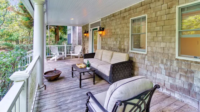 a living room with fireplace furniture and a chandelier