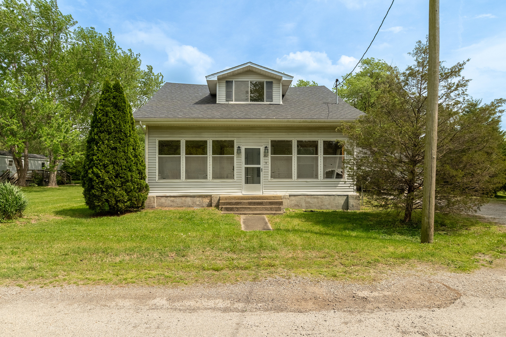 202 South Ervin Street Pittsburg, IL 62974 - Photo 1 of 42 a front view of a house with a yard