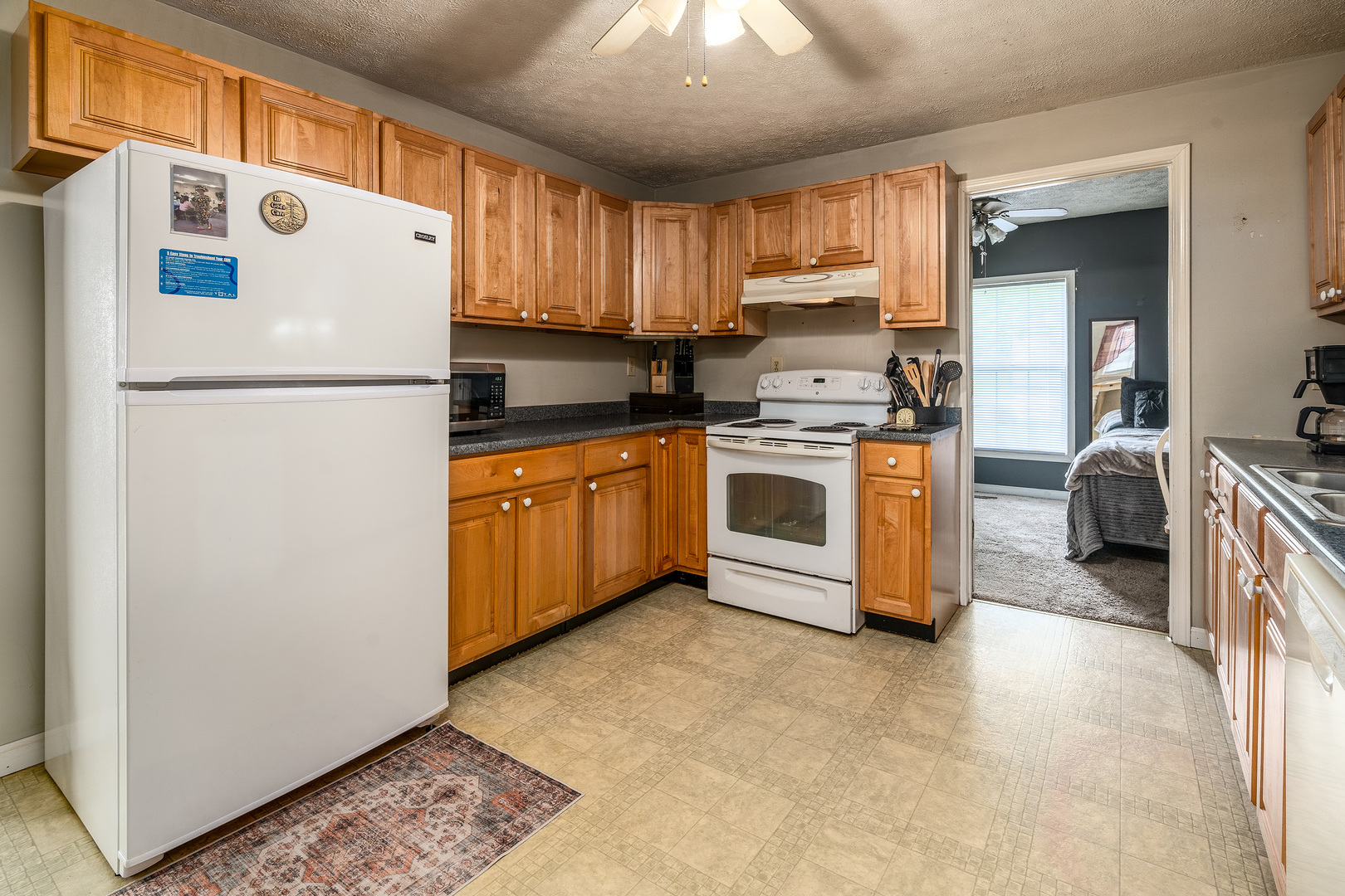 202 South Ervin Street Pittsburg, IL 62974 - Photo 11 of 42 a white refrigerator freezer sitting inside of a kitchen